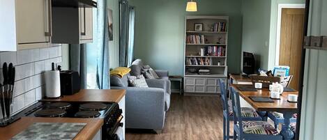 Fridge, toaster, high chair, cookware/dishes/utensils