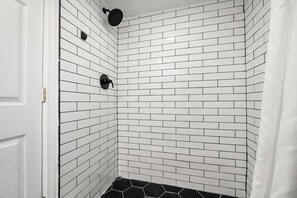 Shower, hair dryer, towels - Apartment by Electric Works | Parking Included (Fort Wayne)