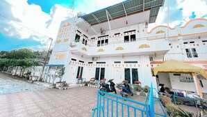 A multi-story hotel with a prominent sign reading "AGAVE HOTEL". - Agave Hotel By Helocus (Pematang Pane)