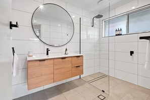 Shower, hair dryer, towels, shampoo