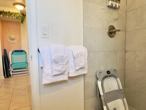 Shower, hair dryer, towels, soap