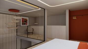 A modern bedroom with a bed, a chair, a mirror, and a wardrobe.
