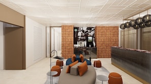 Relax in a spacious room with a seating area, featuring a sofa, ottomans, and a coffee table.