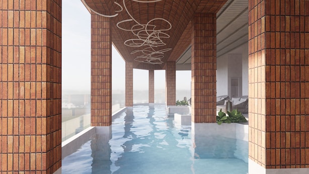 A modern indoor swimming pool with brick walls and a clear view of the cityscape. - Citadines Tanjung Tokong Penang (George Town)