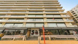 A multi-story building with a restaurant named "bistro resto" and a store named "SIRIUS" on the ground floor. - Apartment in Blankenberge near Belgium Pier (BLANKENBERGE)
