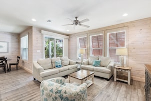 Signature House, 2 Bedrooms, Balcony, Garden View | Living room | 65-inch Smart TV with cable channels
