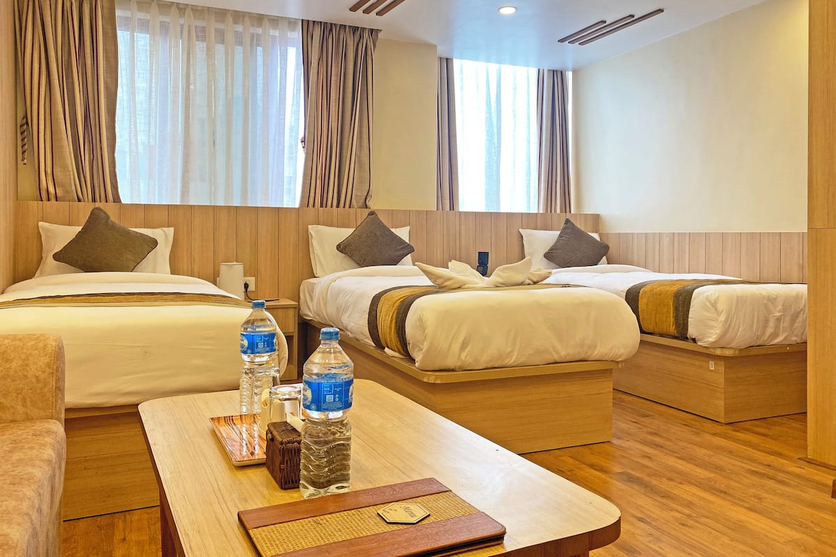 Deluxe Triple Room, City View | Desk, laptop workspace, soundproofing, free WiFi