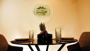 A round table with a pineapple centerpiece, two glasses, and a plate. - SeeZeit at Walchsee (Walchsee)
