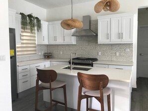 Fridge, microwave, stovetop, cookware/dishes/utensils
