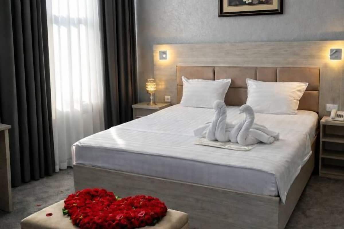 Egyptian cotton sheets, premium bedding, down duvets, laptop workspace