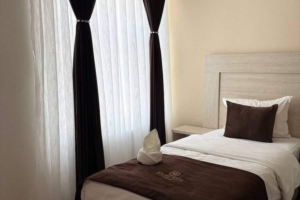 Deluxe eenpersoonskamer | Lakens van Egyptisch katoen, luxe beddengoed, donsdekens