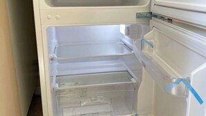 An empty refrigerator with transparent drawers and a freezer compartment. - Cosy 1 Bedroom Apartment Private Access in Guildford

 (Guildford)