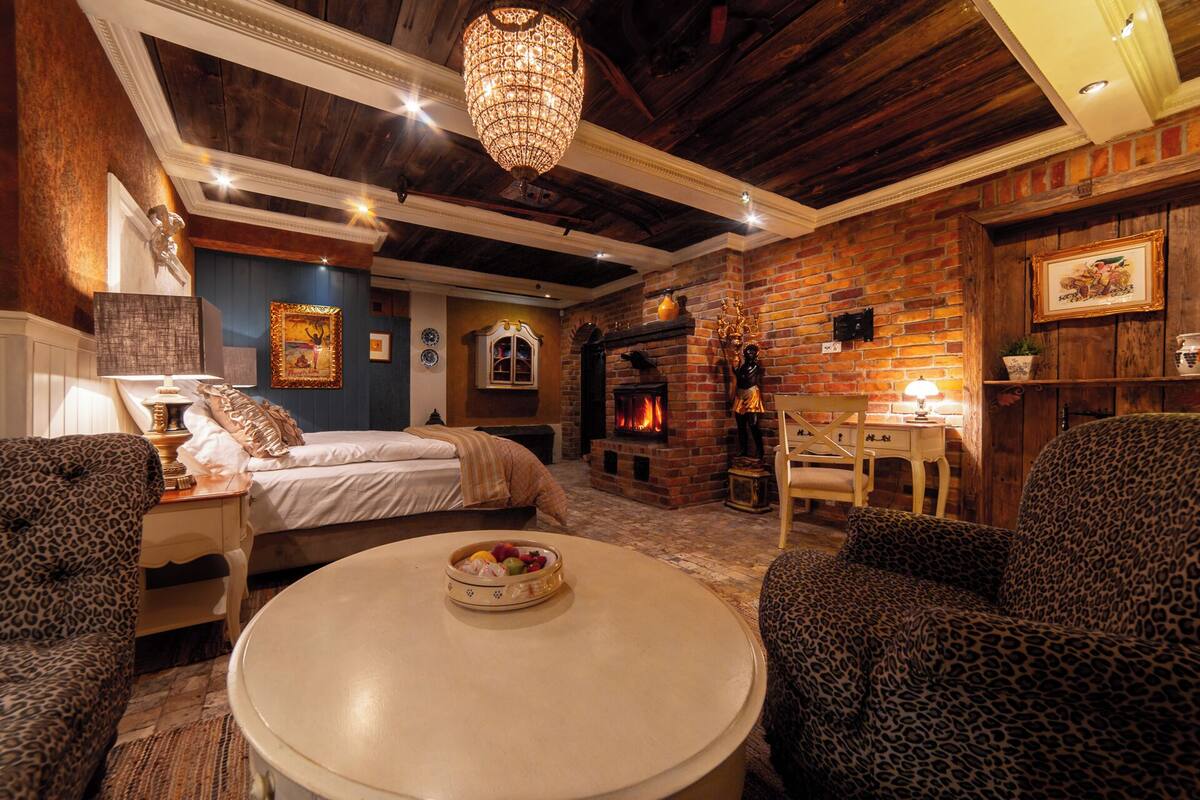 Deluxe Suite, 1 Queen Bed, Private Bathroom, Ground Floor | In-room safe, blackout curtains, iron/ironing board (on request)