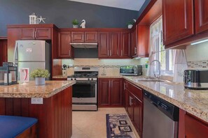 Fridge, microwave, stovetop, cookware/dishes/utensils