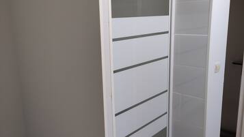 A white, wall-mounted cabinet with multiple shelves.