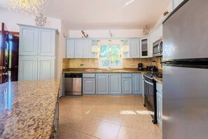 Fridge, microwave, stovetop, cookware/dishes/utensils