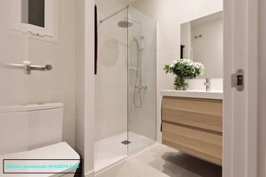 Shower, hair dryer, towels, shampoo