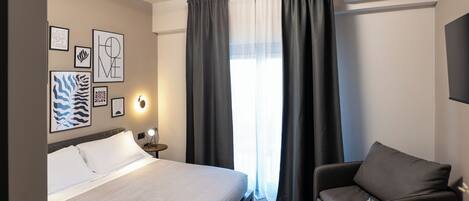 Premium bedding, blackout drapes, iron/ironing board, free WiFi