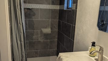 Shower, towels, soap, toilet paper