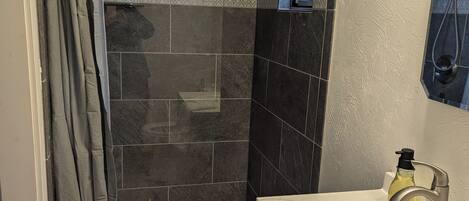 Shower, towels, soap, toilet paper