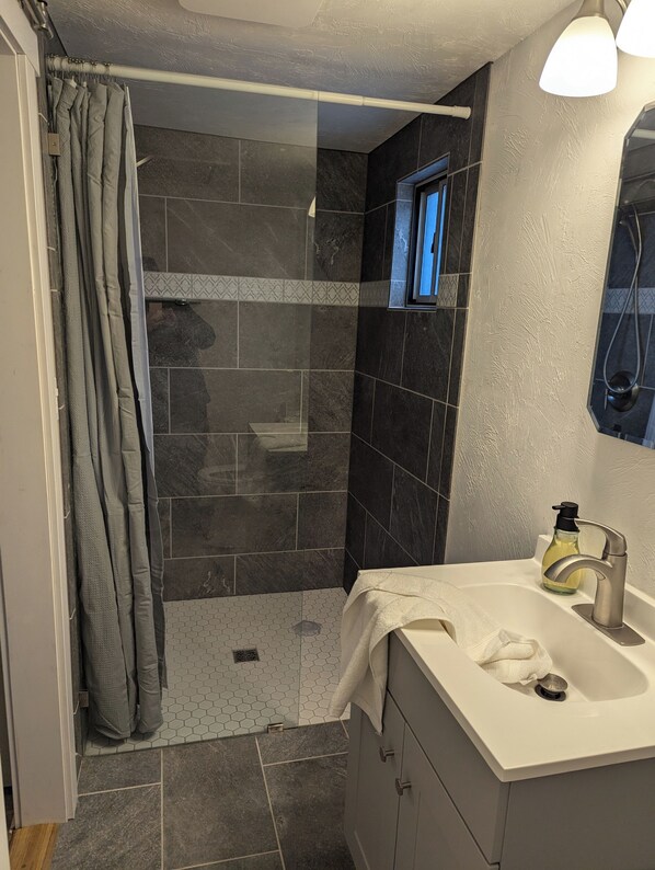 Shower, towels, soap, toilet paper