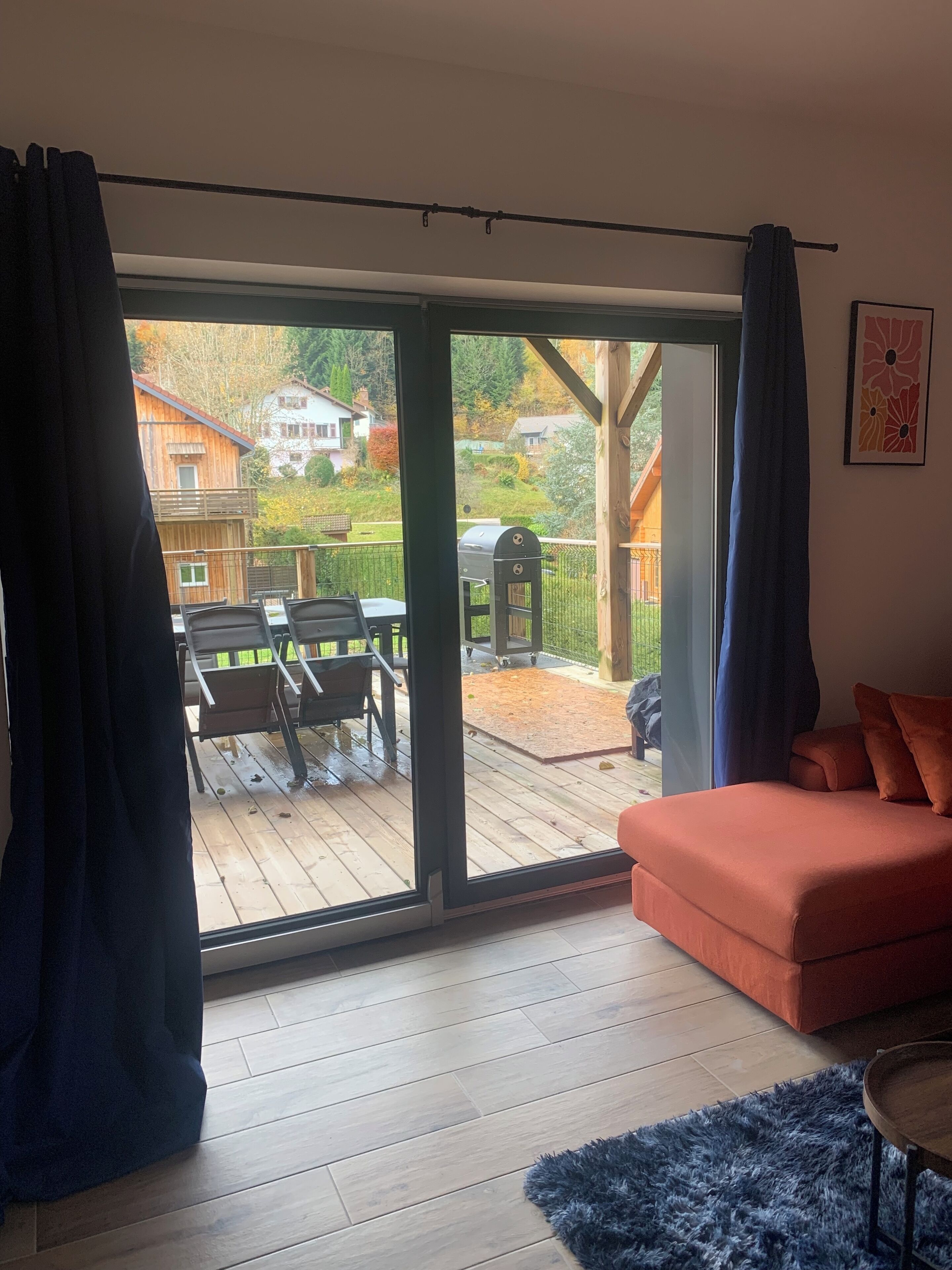 A room with a sliding glass door leading to an outdoor patio area.