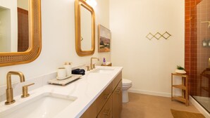 A bathroom with two sinks, a toilet, and a shower. - A-Frame, HotTub, FirePit, Pergola, UFO Playscape, MiniAFrame ADU (Crestone)