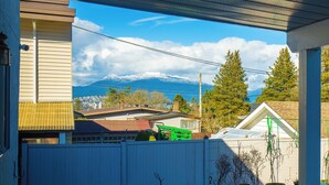 A residential area with a view of mountains and a clear sky.
