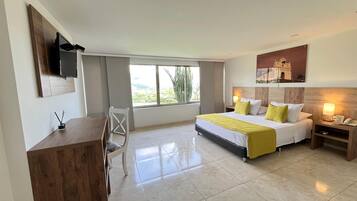 Standard Double Room | Minibar, in-room safe, desk, iron/ironing board