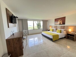 Standard Double Room | Minibar, in-room safe, desk, iron/ironing board