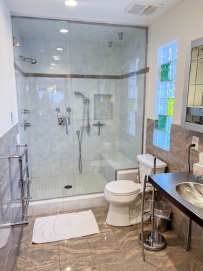 Shower, hair dryer, towels, soap