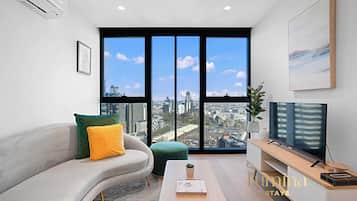 Apartment, 1 Bedroom | Living area | Flat-screen TV, table tennis