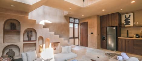 Junior Villa, Pool View | Living area | 50-inch flat-screen TV with cable channels