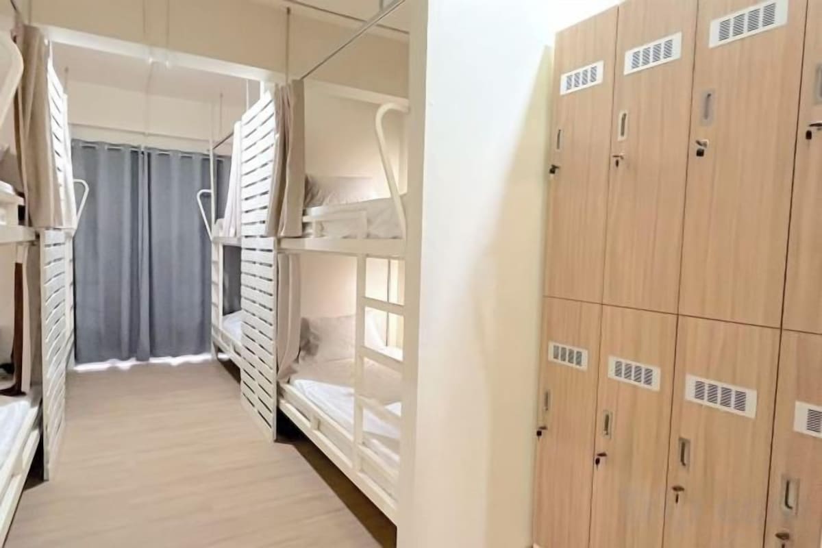 Premium bedding, laptop workspace, blackout drapes, soundproofing