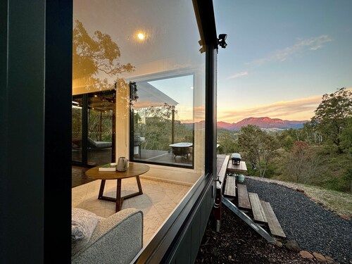 A tranquil getaway awaits... Luxurious cabin with breath-taking mountain views.