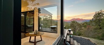 A tranquil getaway awaits... Luxurious cabin with breath-taking mountain views.