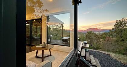 A tranquil getaway awaits... Luxurious cabin with breath-taking mountain views.