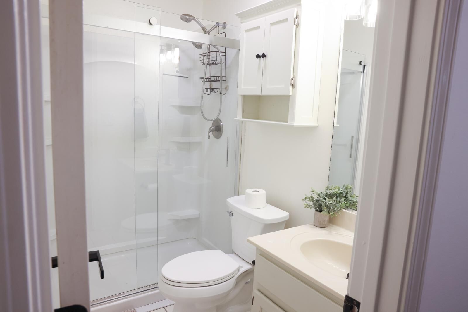 Shower, hair dryer, towels, toilet paper