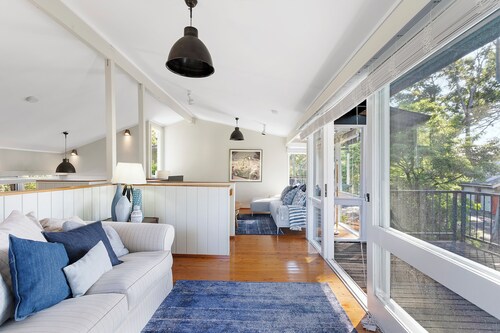 Tranquil family-sized treehouse. Ocean glimpses with outdoor deck. 