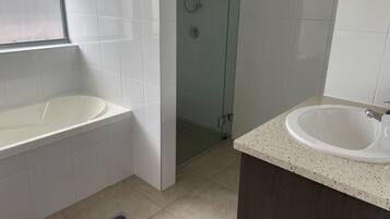 Shower, hair dryer, towels, toilet paper