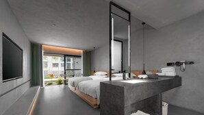 A modern hotel room with a large bed, a bathroom with a large mirror, and a view of the outdoors. - HUANG GUO SHU DUO BEI YUN SHE HOTEL (Anshun)