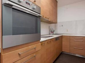 Apartment (Three-Bedroom Apartment) | Private kitchen | Fridge
