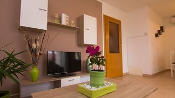 Apartment (Two Bedroom Apartment with Terrace) | Living room | 32-inch flat-screen TV with cable channels