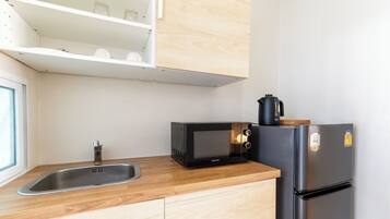 Standard Double Room | Private kitchen | Fridge, microwave, coffee/tea maker, electric kettle