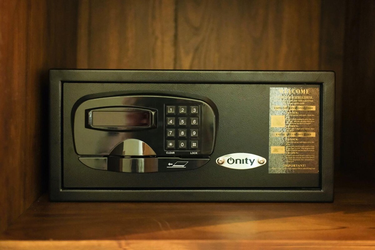 A black security keypad with a clear instruction panel beside it.