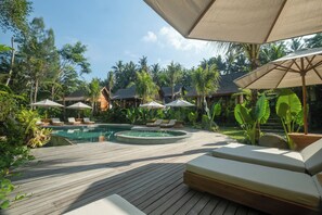 Outdoor pool, open 7:00 AM to 10:30 PM, pool umbrellas, sun loungers