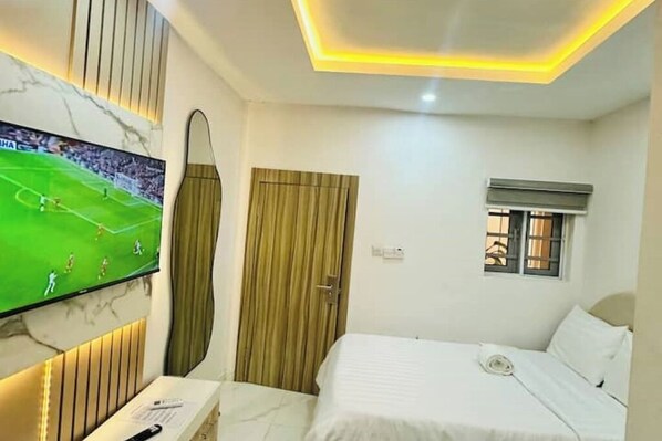 1 غرفة نوم ومكواة/لوح كي وواي فاي وملاءات أسرّة