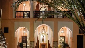 A courtyard with a fountain, seating, and a view of the interior. - This Time Tomorrow in Marrakech (Marrakech)