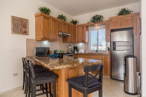 Fridge, microwave, stovetop, cookware/dishes/utensils