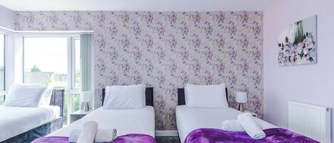 4 bedrooms, desk, iron/ironing board, travel cot